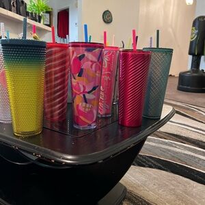 Starbucks tumblers… Venti.  All colors and kinds
